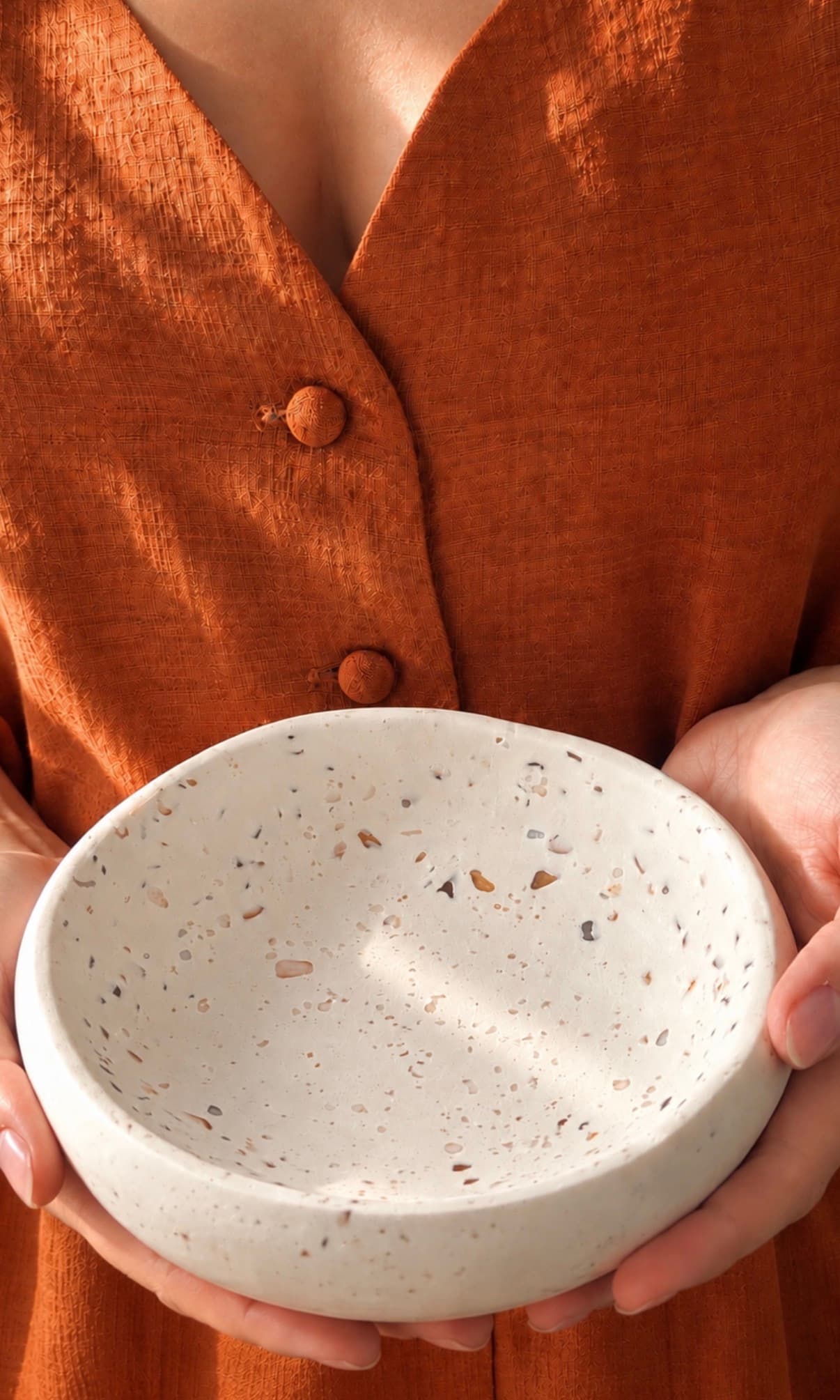 Terrazzo bowl held in two hands