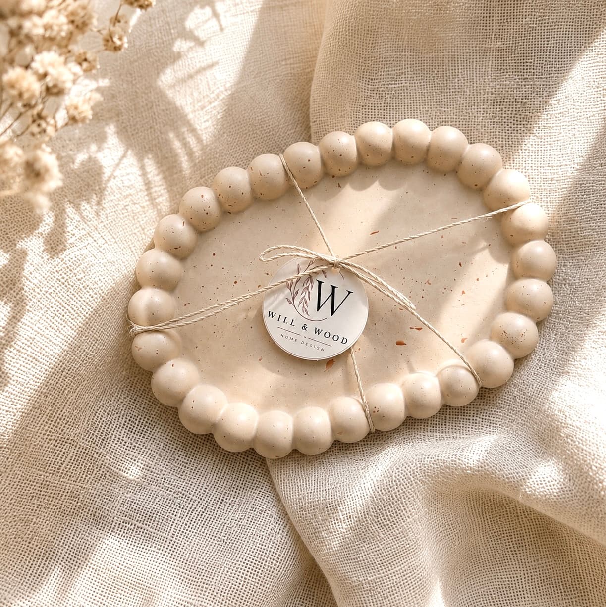Beaded tray wrapped with a Will & Wood label